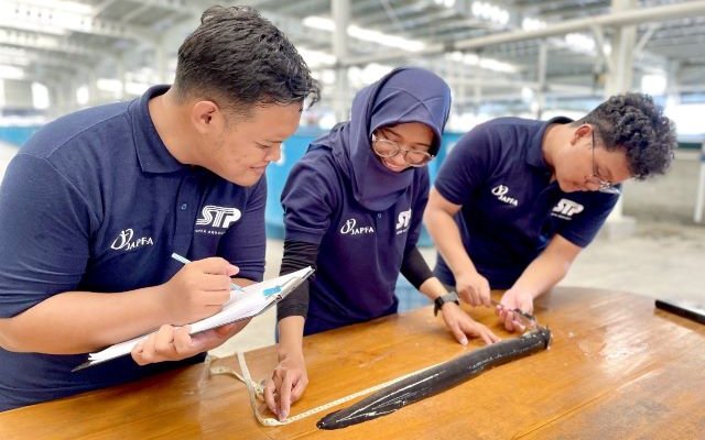 IMage 3 ARC Team checks adult eel