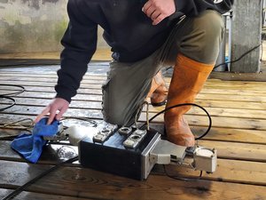 ReelData engineer cleaning the ReelBiomass camera lenses